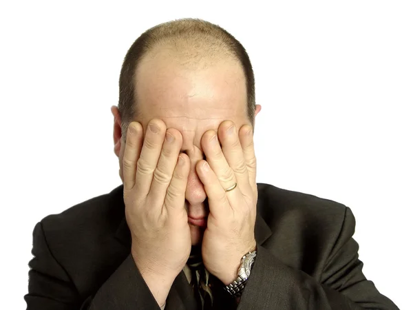 Businessman with hands over face — Stock Photo, Image