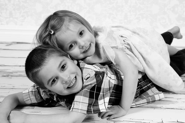 Little brother and Sister in studio Stock Picture