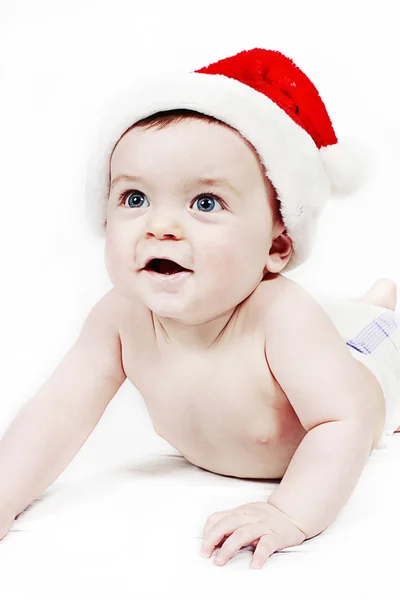 Mignon petit garçon dans le chapeau du Père Noël — Photo