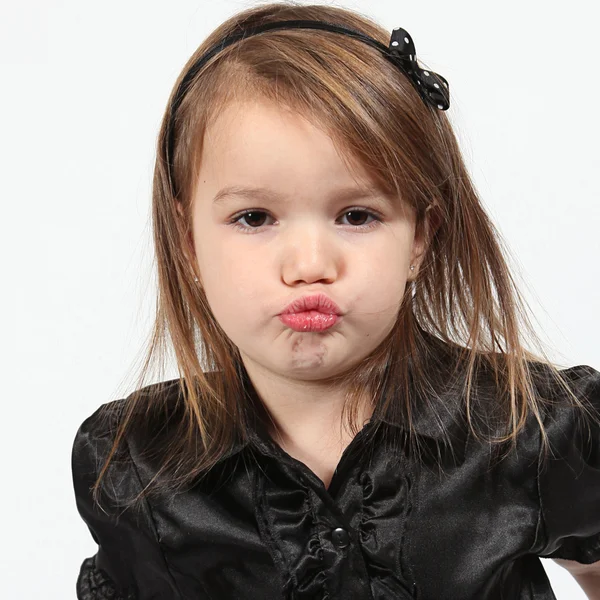 Little girl making faces — Stock Photo, Image