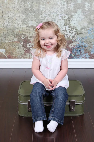 Little Girl Sitting on Suitcase — Stock Photo, Image