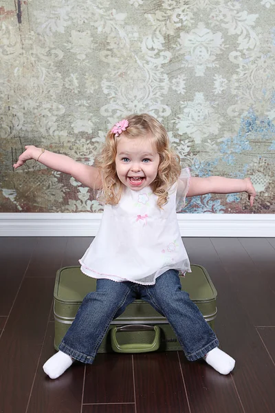 Little Girl Sitting on Suitcase — Stock Photo, Image