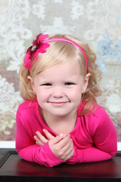 Little Girl leaning on vintage chest — Stock Photo, Image