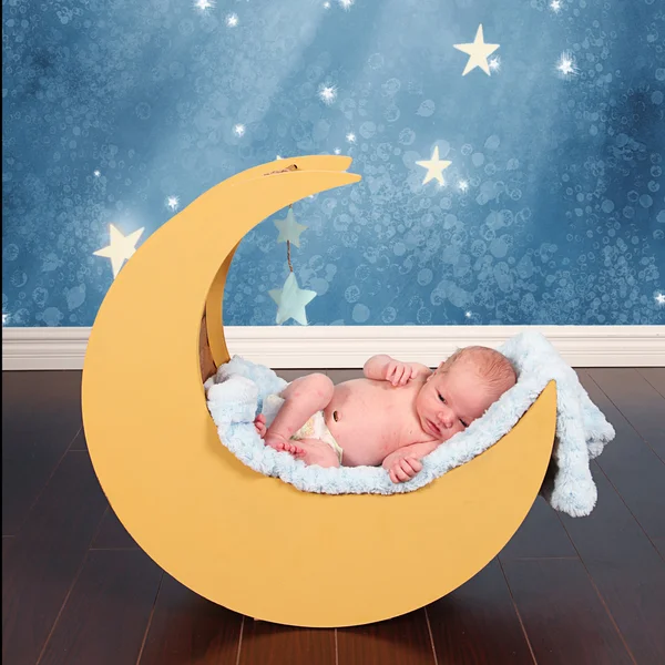 Baby boy in moon prop — Stock Photo, Image