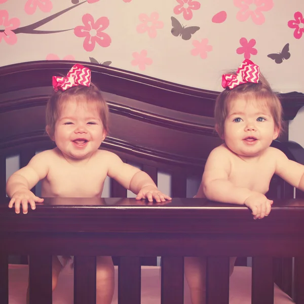 Twins in crib — Stock Photo, Image