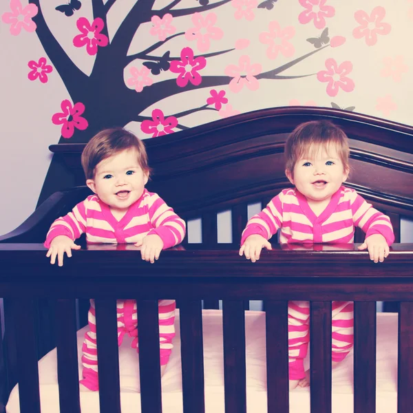 Twins in crib — Stock Photo, Image