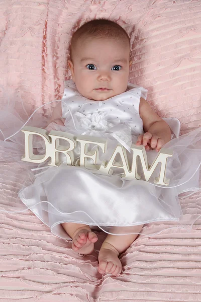 Little girl lying on blanket — Stock Photo, Image