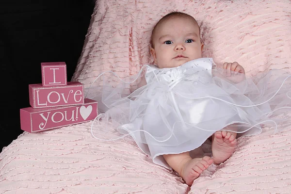 Little girl lying on blanket — Stock Photo, Image