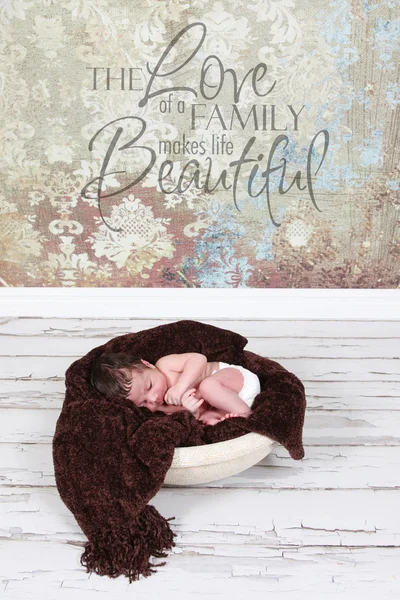 Baby boy sleeping on brown blanket — Stock Photo, Image