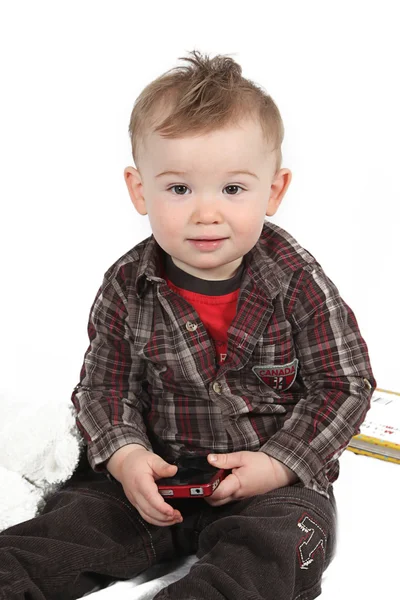 Baby with smartphone sitting on floor — Stock Photo, Image