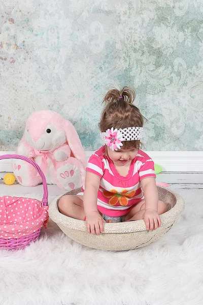 Little girl in basket — Stock Photo, Image