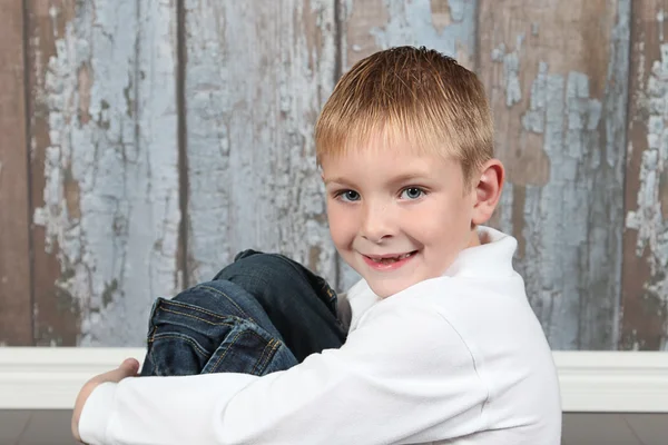 Little boy posing in old empty room — Stock Photo, Image