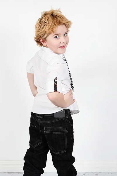 Little boy posing in empty room — Stock Photo, Image