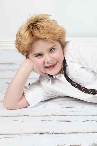 Little boy lying on floor — Stock Photo, Image