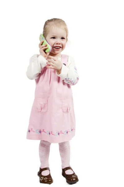 Adorável menina com telefone de brinquedo — Fotografia de Stock