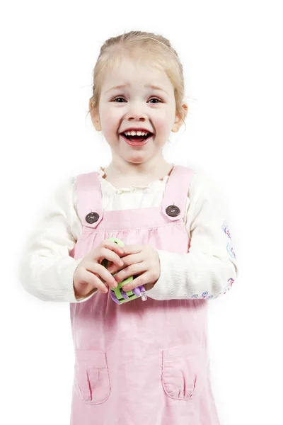 Schattig meisje met speelgoed telefoon — Stockfoto