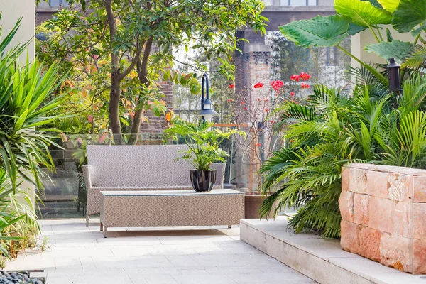 Backyard Cane Chair Table Garden Stock Photo