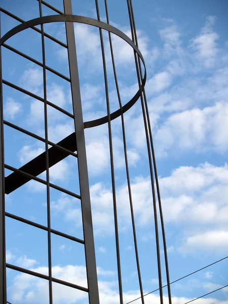 Metal construction against sky and clouds — Stock Photo, Image