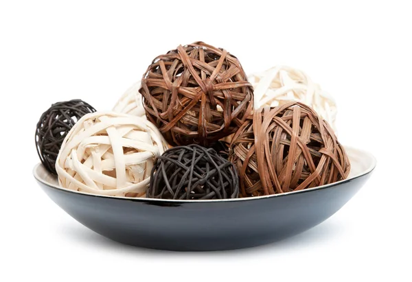 Decorative spheres lay in wooden bowl — Stock Photo, Image