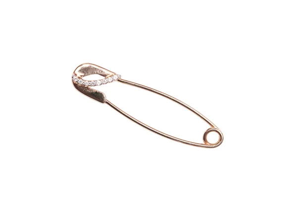 The golden brooch in the form of a safety pin — Stock Photo, Image