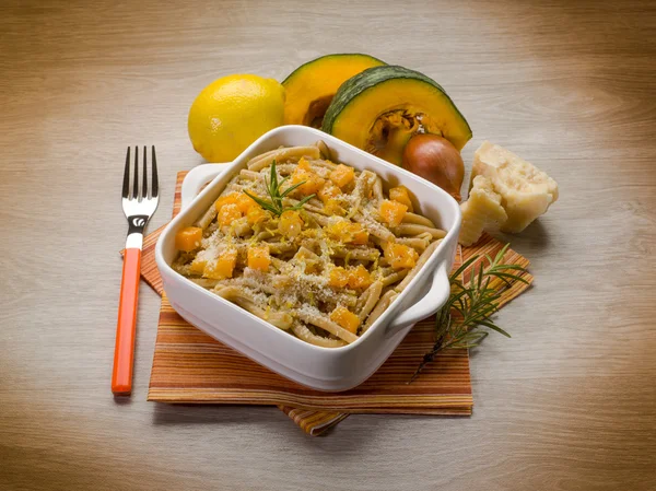 Pasta casarecce with pumpkin, lemon peel and parmesan cheese — Stock Photo, Image