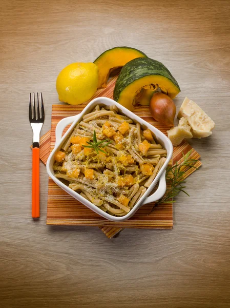 Pasta casarecce with pumpkin, lemon peel and parmesan cheese — Stock Photo, Image