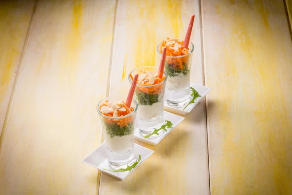 Finger food with ricotta arugula carrot and sliced almond — Stock Photo, Image