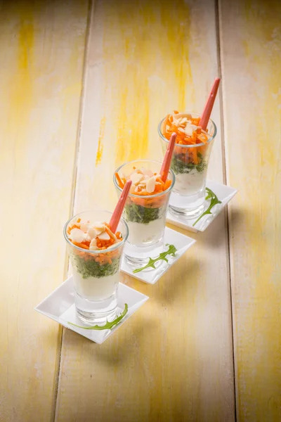 Finger food with ricotta arugula carrot and sliced almond — Stock Photo, Image