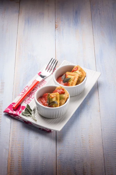 Fried ravioli with tomatoes sauce — Stock Photo, Image