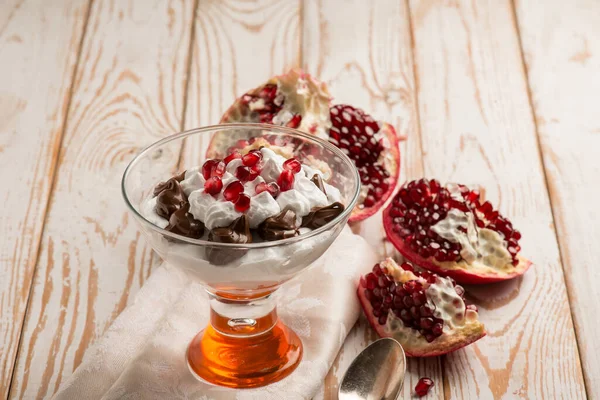 dessert cup with pomegranate chocolate and  chantilly cream