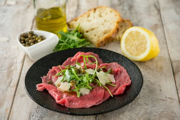 Beef Carpaccio Arugula Capers Parmesan Cheese — Stock Photo, Image