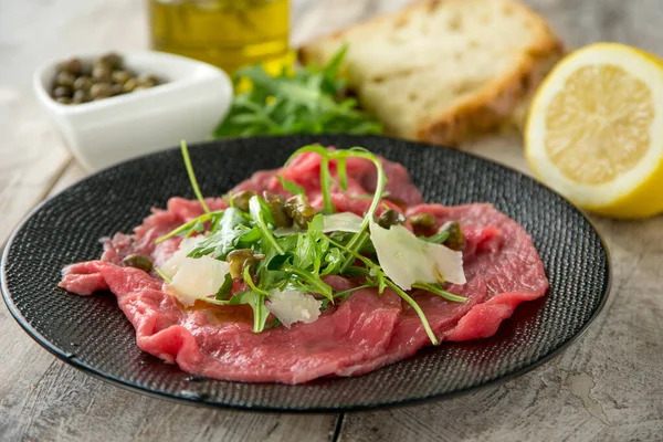 Beef Carpaccio Arugula Capers Parmesan Cheese — Stock Photo, Image