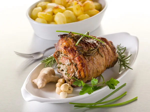 Rolled veal stuffed with nuts, ginger and parsley — Stock Photo, Image