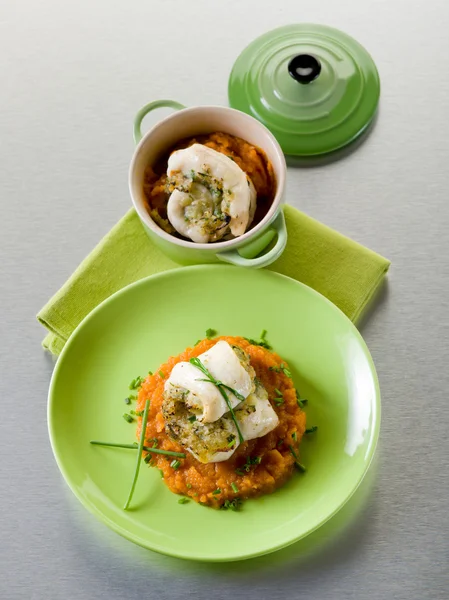 Cod fillet stuffed with herbs over mashed carrot,heatlhy food — Stock Photo, Image