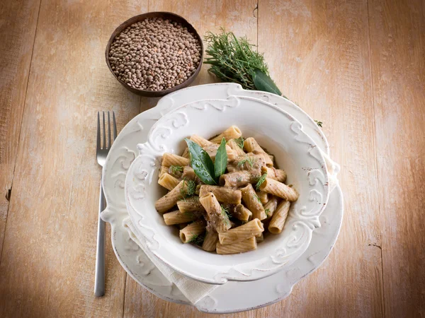 Pasta with red lentils olive oil and pepper — Stock Photo, Image