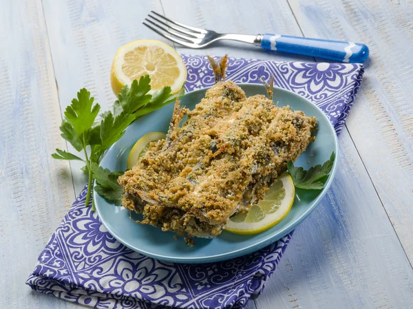 Breaded anchovies with lemon and parsley — Stock Photo, Image