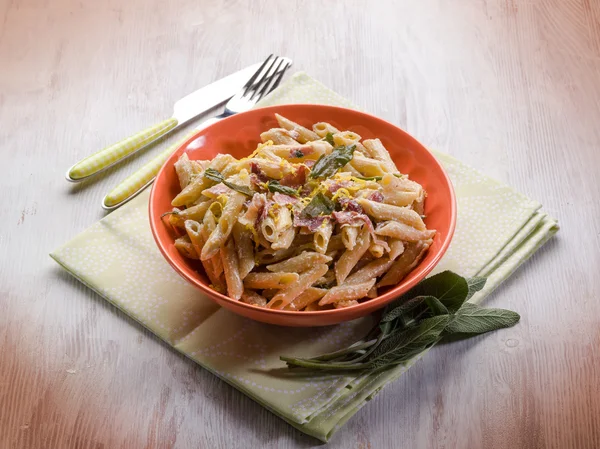 Pasta with speck sage and cream sauce — Stock Photo, Image