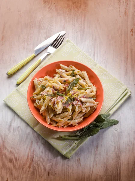 Pasta with speck sage and cream sauce — Stock Photo, Image