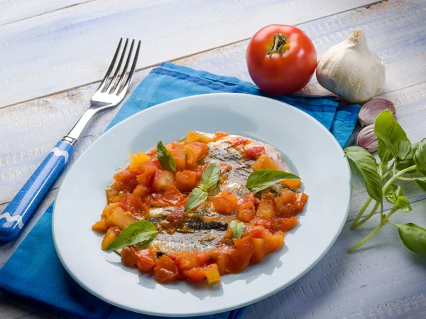 Anchovy with capsicum and tomato sauce — Stock Photo, Image