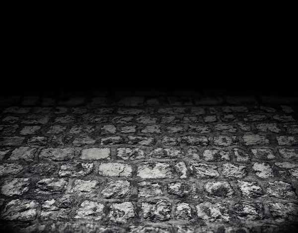 Dark interior paved with cobblestones — Stock Photo, Image