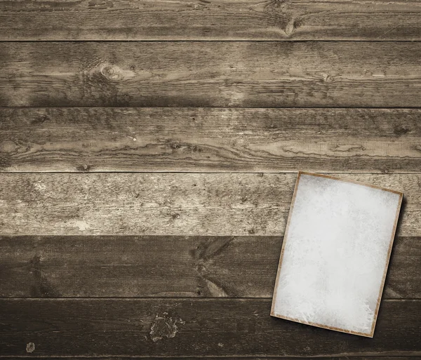 Old white paper sheet on wooden table — Stock Photo, Image