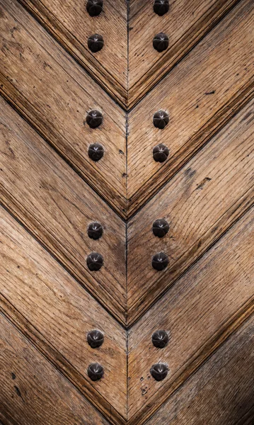 Old wooden door texture with metal nails — Stock Photo, Image