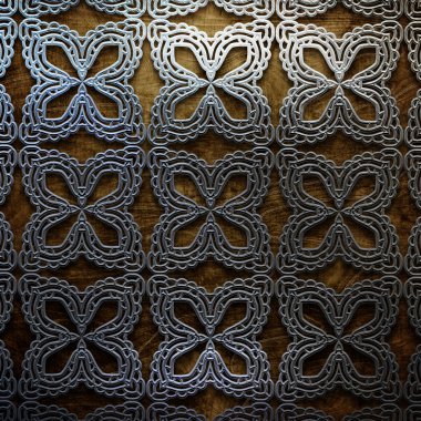 Eski ahşap zemin üzerine metal süs. Vintage koleksiyonu