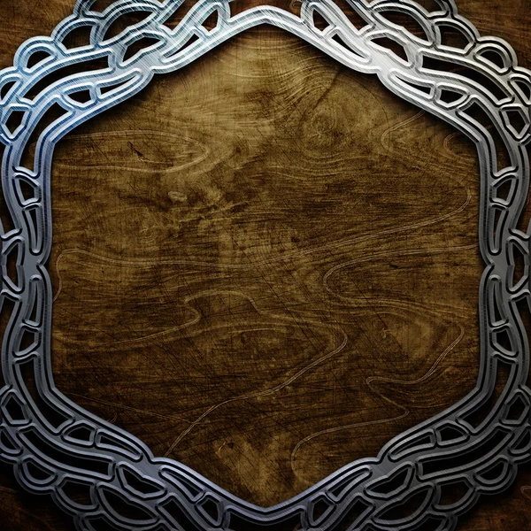 Metal ornamental frame on old wooden background . Vintage collection — Stock Photo, Image