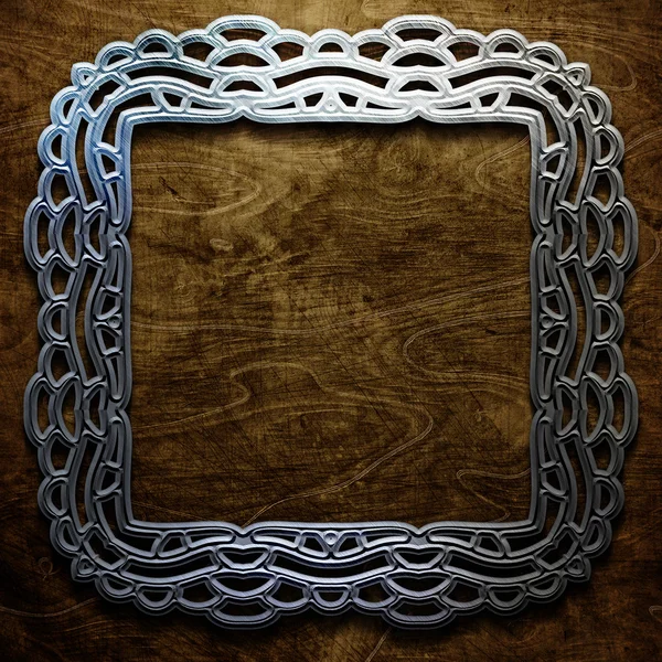 Metal ornamental frame on old wooden background . Vintage collection — Stock Photo, Image