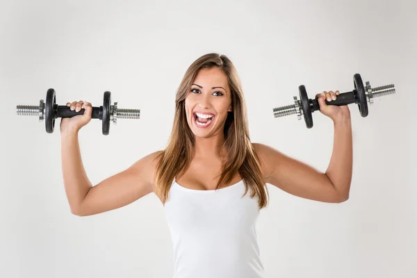 Woman Doing Exercises With Dumbbell Royalty Free Stock Photos