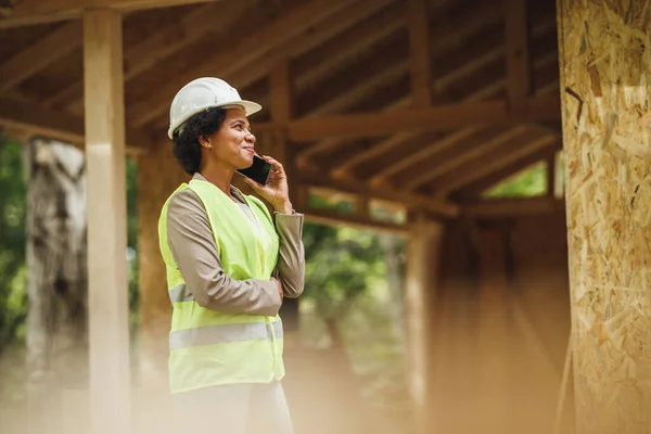 Shot African Female Architect Talking Smartphone Checking Construction Site New — Stock Photo, Image