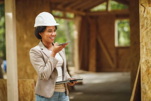 Shot African Female Architect White Helmet Using Smartphone Checking Construction — Stock Photo, Image