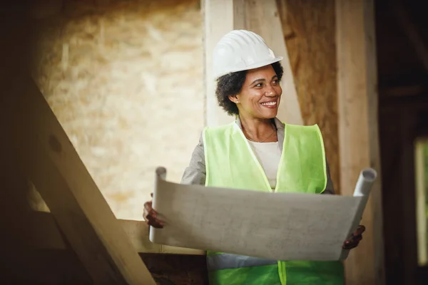 Shot African Female Architect Checking Plans Construction Site New Wooden — Stock Photo, Image