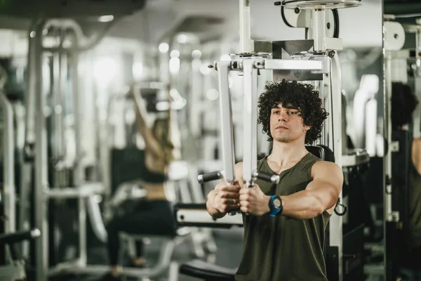 Young Muscular Man Doing Training Machine Gym — Stock Photo, Image